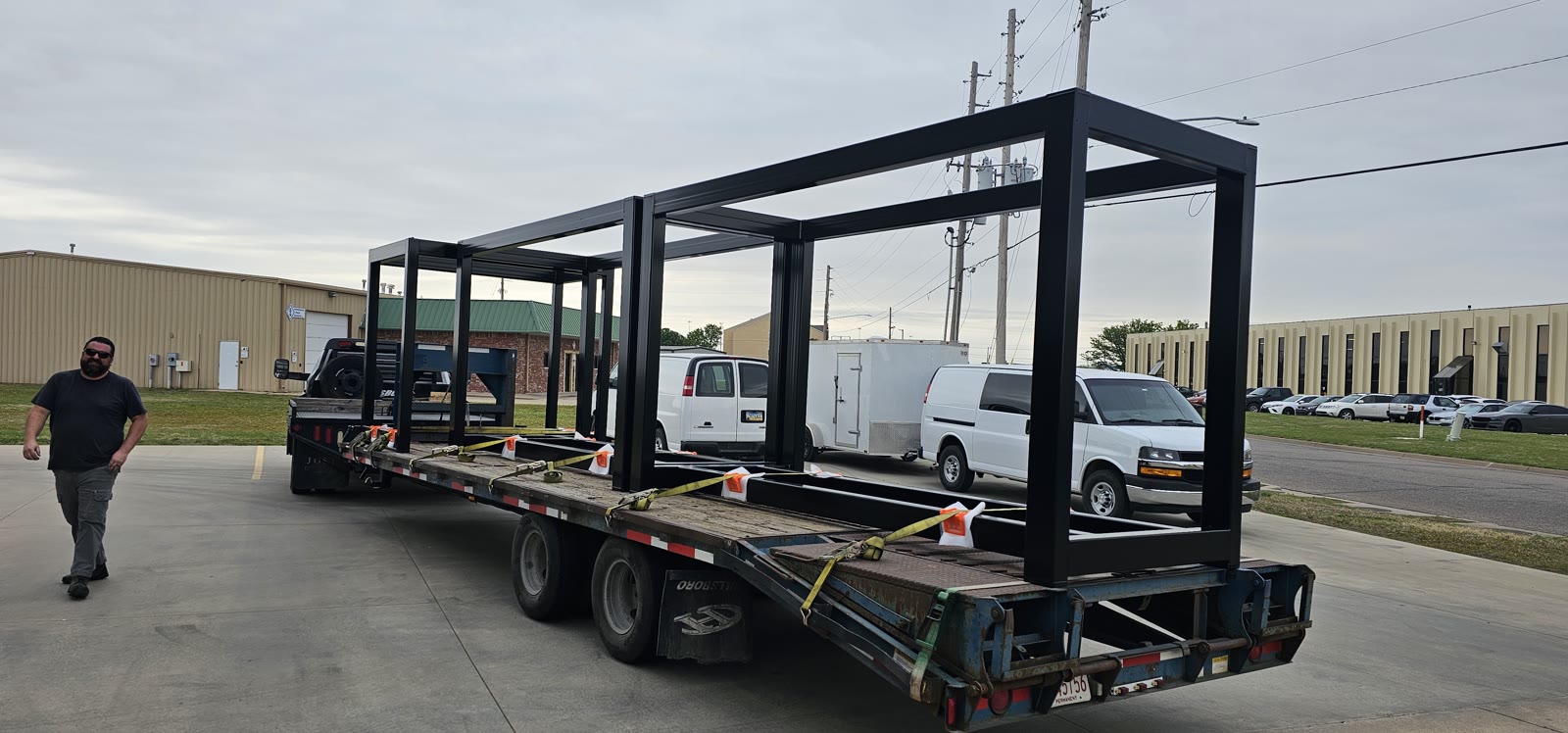Large structural steel weldment staged for delivery